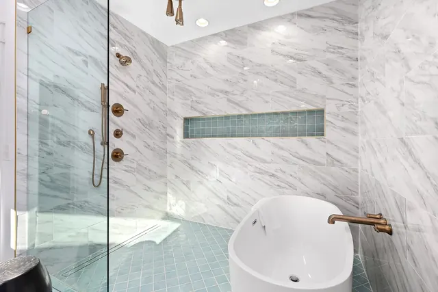 Soaking tub in wet room shower at 1108 Lenore St, Nashville, TN 37206