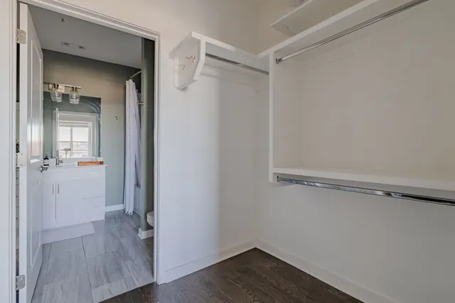 Walk-in closet with built-in shelving at 1677 54th Ave N, 336, Nashville, TN 37209