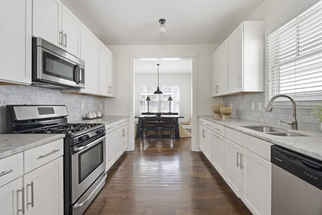 Kitchen opening to dining room at 1708 B 4th Ave N, Nashville, TN 37208