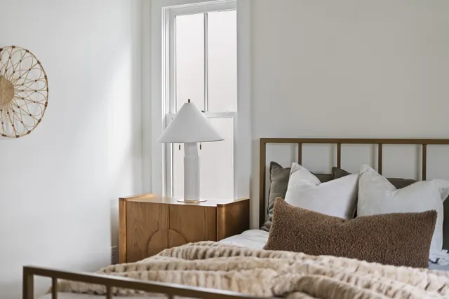 Primary bedroom with nightstand and lamp at 1708 B 4th Ave N, Nashville, TN 37208