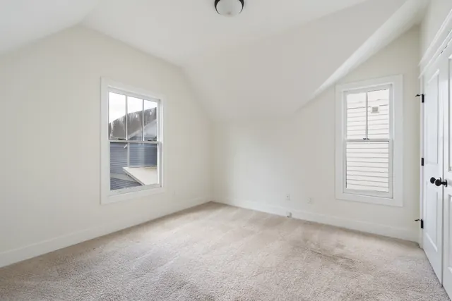 Empty bedroom with sloped ceiling at 1708 B 4th Ave N, Nashville, TN 37208