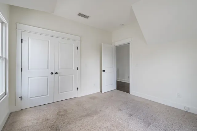 Bedroom with closet doors at 1708 B 4th Ave N, Nashville, TN 37208