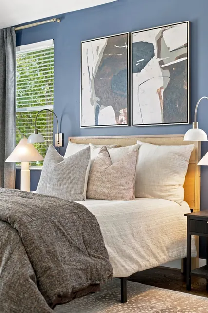 Bed and artwork in primary bedroom at 2216 Sadler Ave, B, Nashville, TN 37210