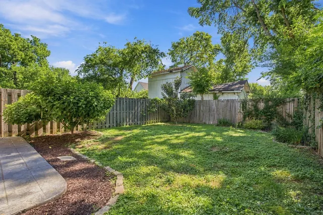 Fenced backyard with lawn at 2216 Sadler Ave, B, Nashville, TN 37210