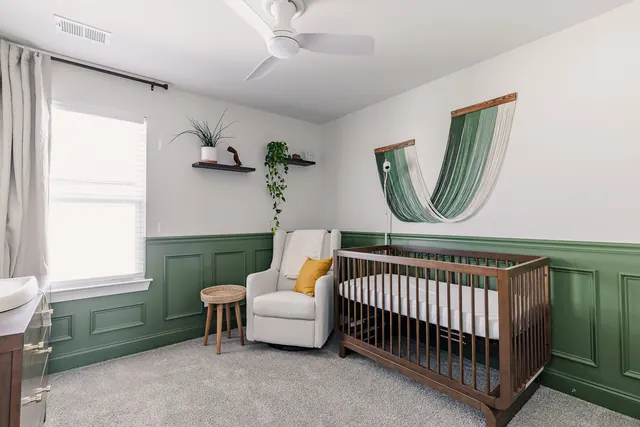 Nursery with crib and wainscoting at 4905 Trail Ridge Ct, Nashville, TN 37207