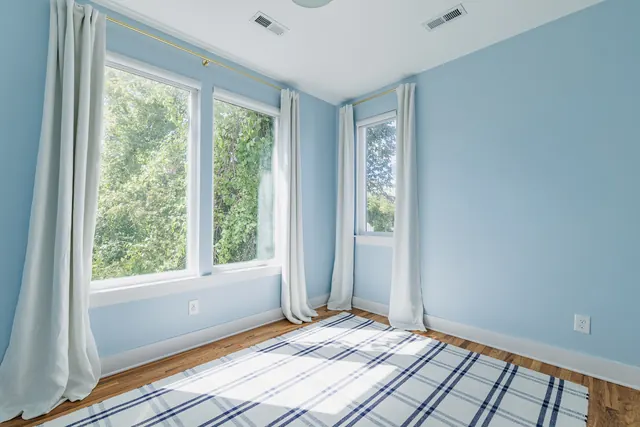 Bedroom with blue walls and windows at 505 Croley Dr, Nashville, TN 37209