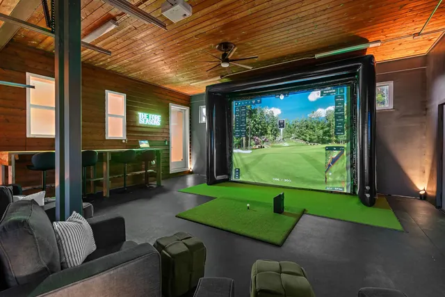 Golf simulator room in garage at 603 S 20th St, Nashville, TN 37206