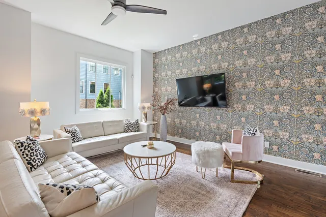 Living room with accent wallpaper at 603 S 20th St, Nashville, TN 37206