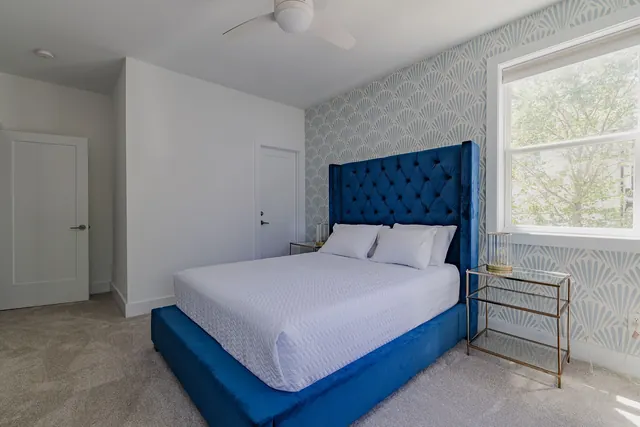 Bedroom with blue upholstered headboard at 603 S 20th St, Nashville, TN 37206