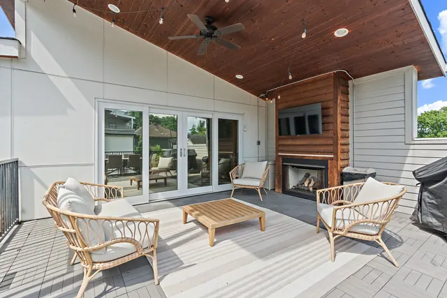 Covered patio with fireplace and seating at 603 S 20th St, Nashville, TN 37206